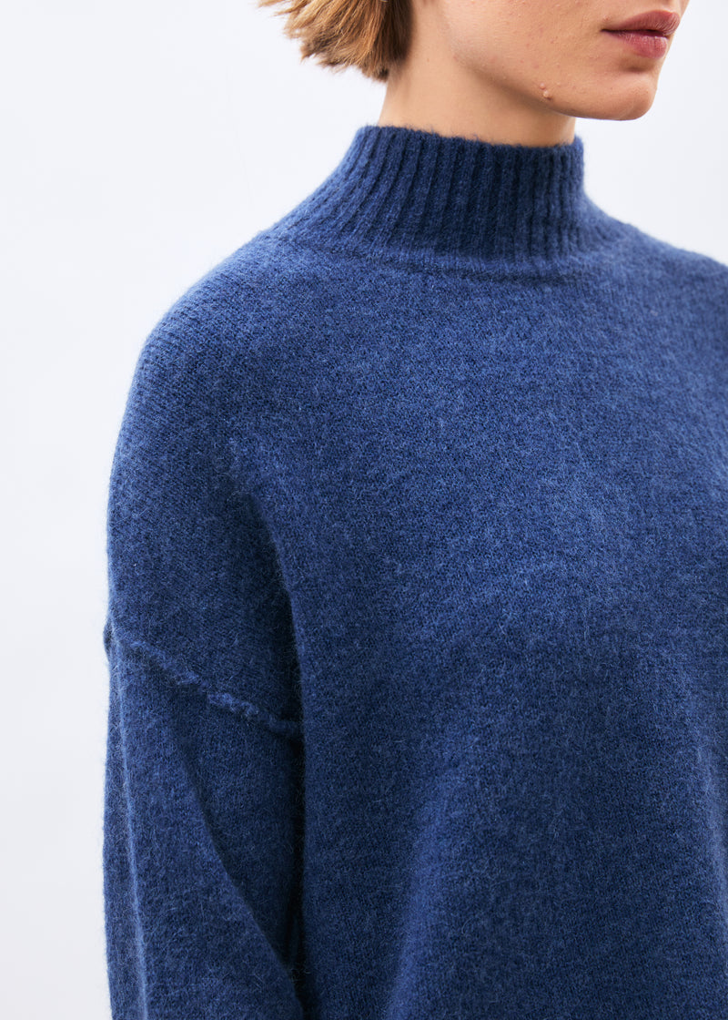 Blue high-neck sweater ~ humility