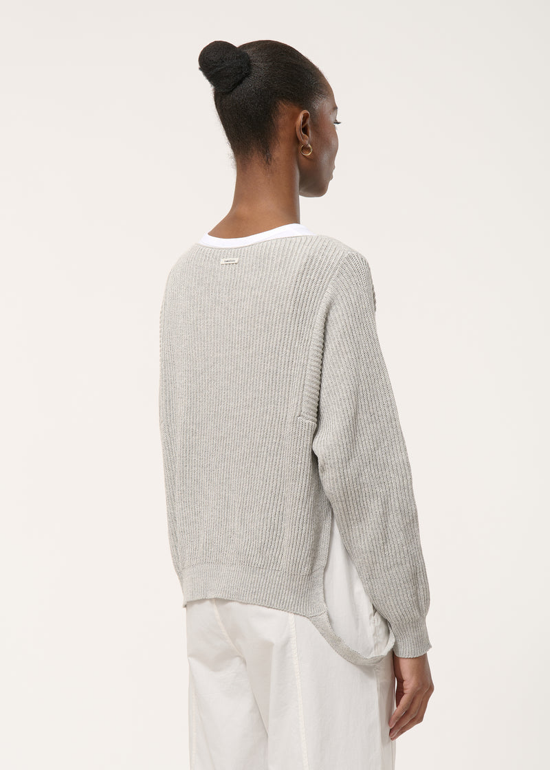 Loose grey knitted sweater